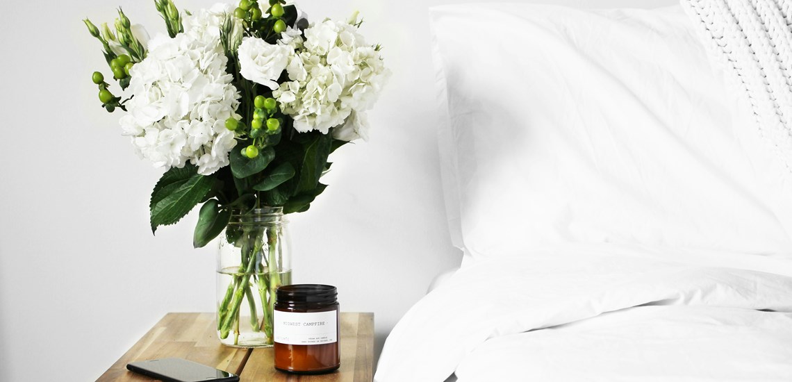 spring-flowers-next-to-bed